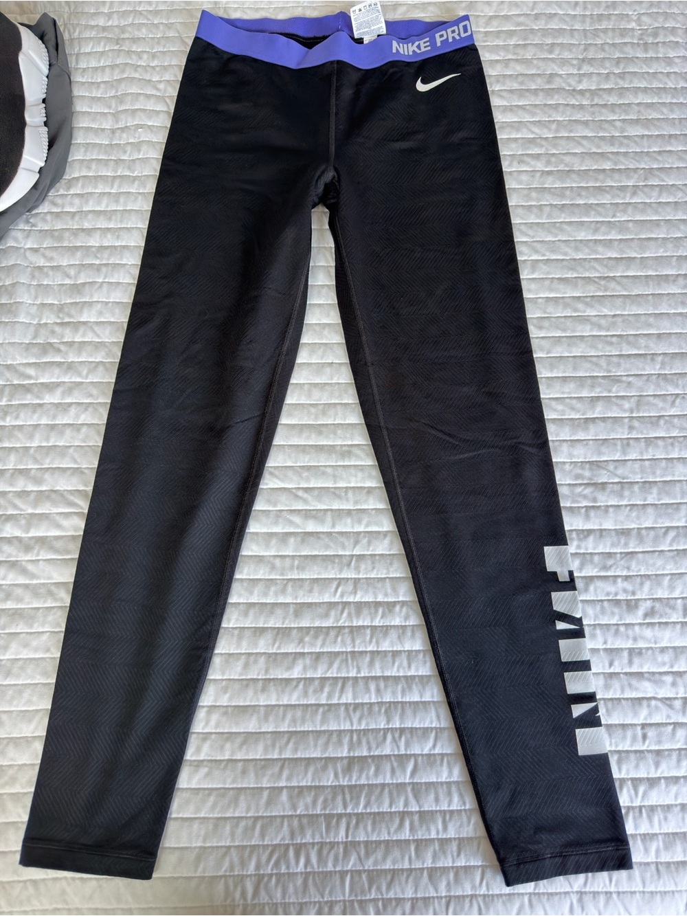 Nike Pro Woman’s Black Leggings with Purple Waistband